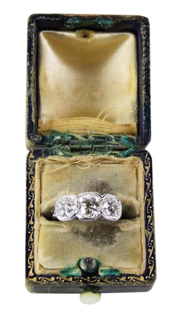 Antique Platinum and Old Mine Cut Diamond Ring: Antique platinum and old mine cut diamond three-stone ring, center 0.625 ct, sides 0.50 ct each. Provenance: Beverly, Massachusetts collection. PLEASE NOTE: payment for silver, gold, jewelry, and coin