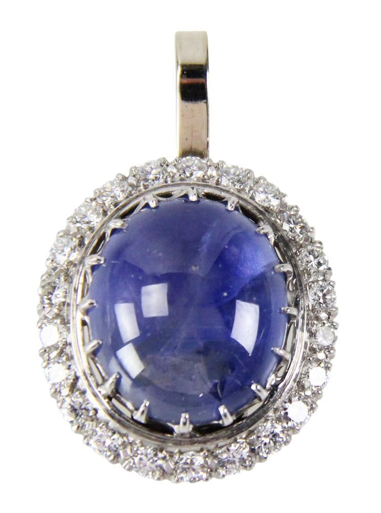 Large Platinum, Star Sapphire, and Diamond Pendant: Large platinum, star sapphire, and diamond pendant, center stone approximately 20.0 ct. Approximately 16.4 grams TW. Provenance: New York City, New York collection. PLEASE NOTE: payment for silver, go