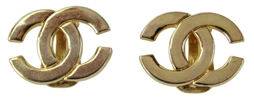 Pair of Chanel Gold Tone Clip Earrings: Pair of Chanel gold tone clip earrings, classic Chanel CC logo, 3/4" H x 1" W. Provenance: Beverly, Massachusetts collection. PLEASE NOTE: payment for silver, gold, jewelry, and coins must be made via