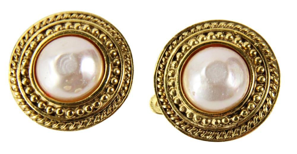 Pair of Chanel Gold Tone Clip Earrings: Pair of Chanel gold tone clip earrings with faux pearls, 1" diameter. Provenance: Beverly, Massachusetts collection. PLEASE NOTE: payment for silver, gold, jewelry, and coins must be made via wire tra