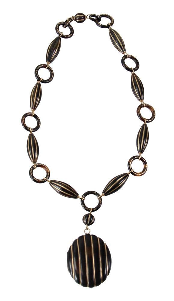 18k Yellow Gold and Tortoise Necklace: 18k yellow gold and tortoise necklace, 17 3/4" L. Some wear to gold on links. Provenance: New York estate. PLEASE NOTE: payment for silver, gold, jewelry, and coins must be made via wire transfer, cas
