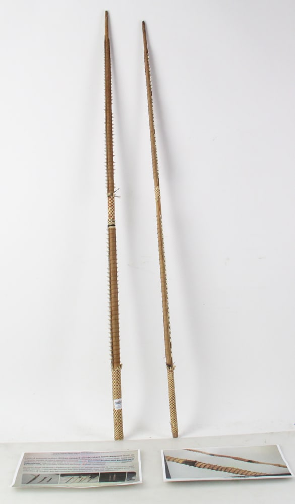 Pair of Authentic Antique Kiribati Shark Tooth Weapons: Pair of authentic antique Kiribati shark tooth weapons, featuring hardwood, coconut sennit fiber, tapa cloth, and woven human hair, 42" L. Provenance: North Bay Village, Florida collection.
