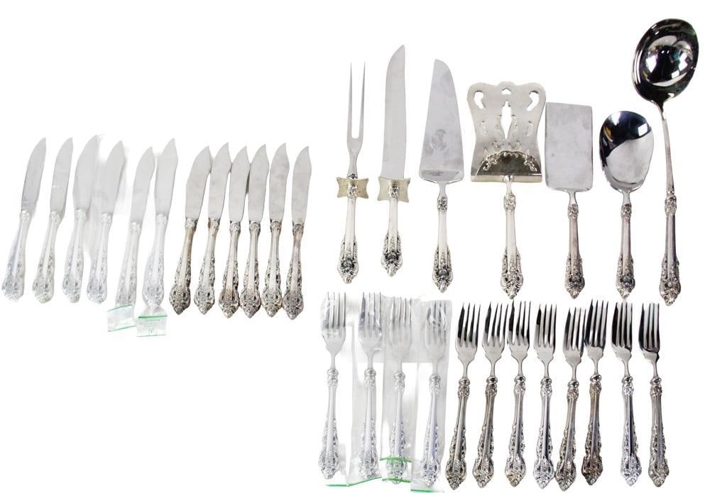 Wallace "Grand Baroque" Sterling and Silverplate Flatware: Wallace "Grand Baroque" flatware, to include (7) serving pieces and (24) forks and knives. Serving pieces have sterling handles; forks and knives are all silverplate. Approximately 7.0 troy oz TW (all