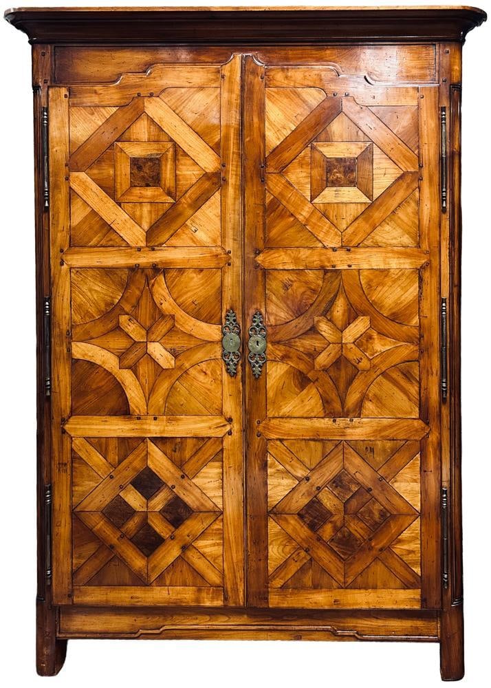 Antique French Louis XVI Style Armoire Malouine: Antique French Louis XVI style armoire Malouine, featuring intricate parquet inlay in walnut and cherry wood, 85" H x 52" W x 24" D. Provenance: Cambridge, Massachusetts collection. PLEASE NOTE: On Ka