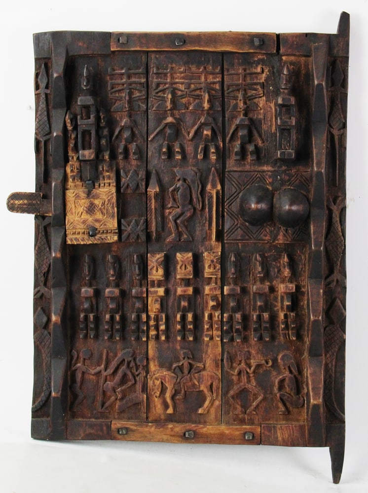 Dogon Granary Door From Mali, West Africa: Dogon granary door from Mali, West Africa, featuring high-relief carvings, 25" x 19". Provenance: Newburyport, Massachusetts collection.