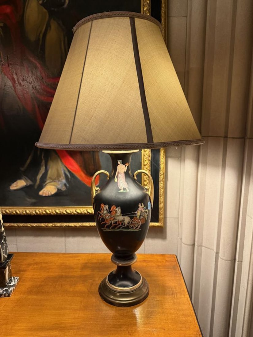 PAIR OF NEOCLASSIC STYLE POTTERY URN LAMPS: A PAIR OF NEOCLASSIC STYLE POTTERY URNS, each of baluster form, drilled and mounted as lamps and decorated with Neoclassic charioteering scenes, restorations. Overall 34 1/2" H x 9 1/2" W. (2) Ch