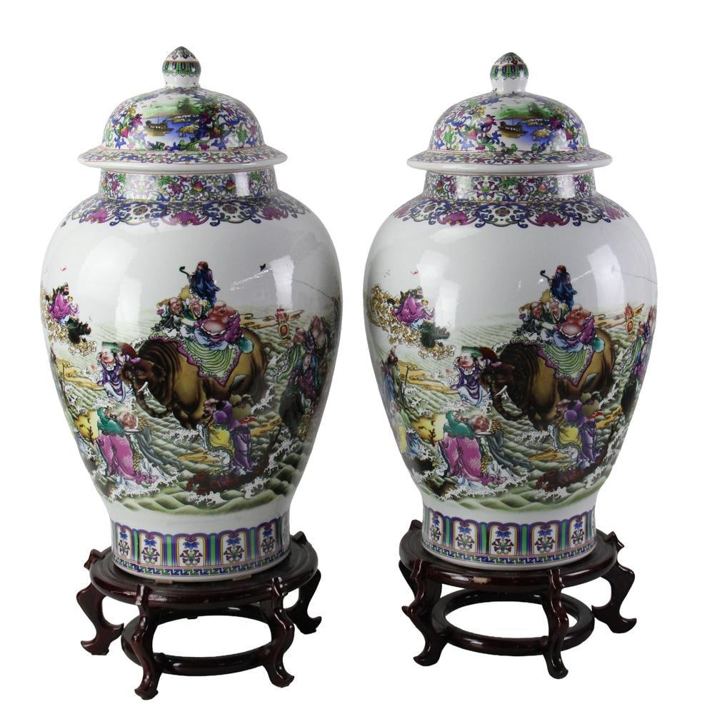 Pair of Chinese Covered Porcelain Jars with Wood Stands: Pair of Chinese covered porcelain jars, 24" x 12", with wood stands 29". Good condition. Provenance: Mashpee, Massachusetts collection.