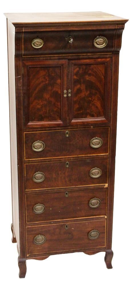 Early 20thC Mahogany Tall Chest: Early 20th century mahogany tall chest with two doors and five drawers veneer panels and classic brass pulls, 53" H x 21" W x 20" D. Provenance: Gloucester, Massachusetts collection.