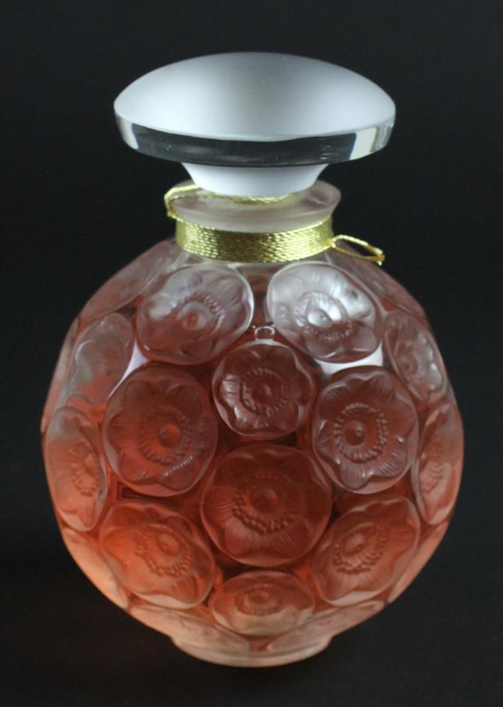 Lalique Sealed Crystal Perfume Bottle "Anemone": Lalique sealed crystal perfume bottle "Anemone", signed "Lalique France", limited edition no. A464, 4 1/4" H, 5.0 oz of perfume, in original gift box. Good condition. Provenance: From the estate of Ch