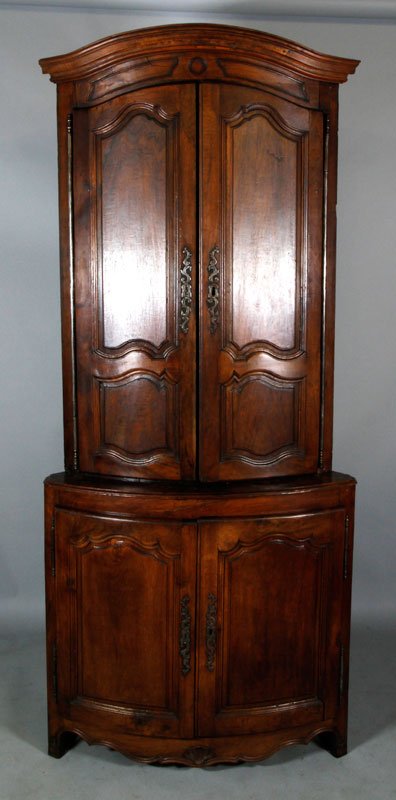 Louis XV Walnut Corner Cabinet: French Louis XV bow front corner cabinet, walnut with serpentine cornice, elaborate steel locks and hinges, 95"h x 41"w x 27"d. Missing key.