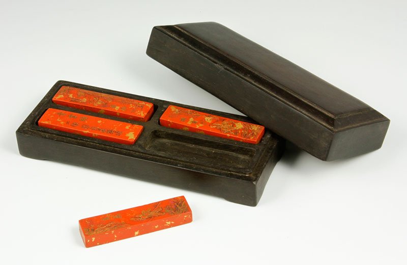 4 Red Ink Bars with Zitan Box: Four red ink bars with zitan wood box, ink 3" l, box 2" x 2 3/4" x 7". Provenance: From a Howell, New Jersey collection.