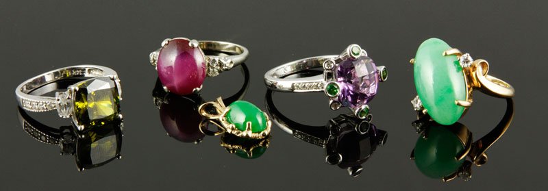 4 Rings and Pendant: Four rings and one pendant, includes: 14k white gold star ruby and diamond ring (size 7 1/2), 14k white gold tsavorite and simulated diamond ring (size 7), 14k yellow gold jade and diamond ring (size