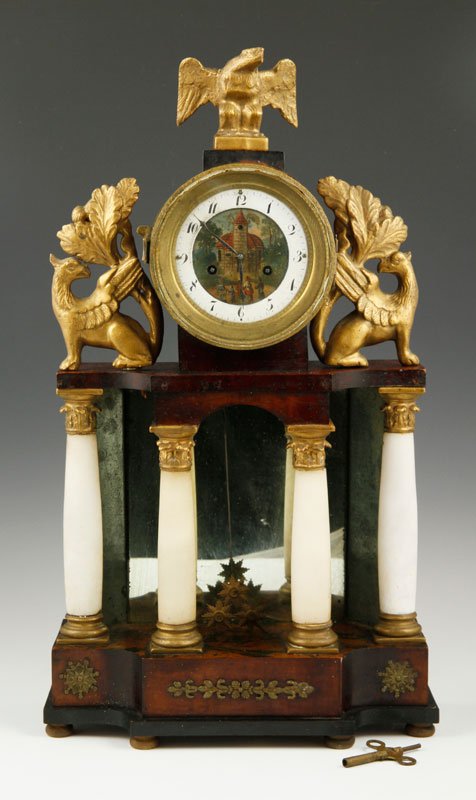 Continental Antique Shelf Clock: Continental antique shelf clock with gilded gryphons on sides and eagle at top, mahogany with painted metal dial. Provenance: From a Cohasset, MA collection.