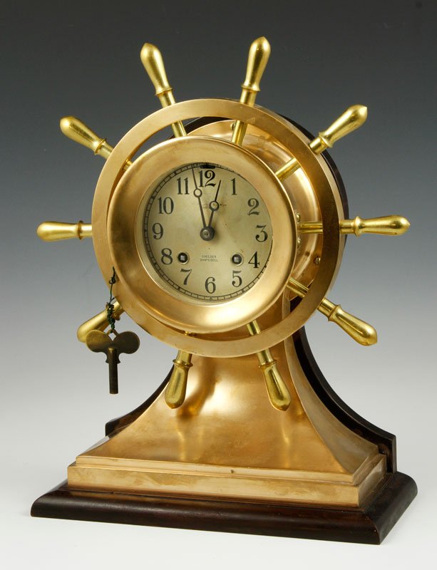 Chelsea Ship's Bell Clock: Chelsea ship's bell clock with ship wheel, brass and wood, includes key, dated June 1936, brass plaque includes the names Robert Winslow, Edward Winslow, K.W. Winslow, Emery Taylor, and Ralph Wheelock