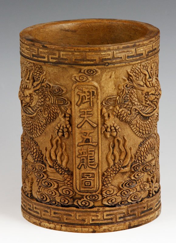 Chinese Carved Soapstone Brush Pot: Carved soapstone brush pot, China, carved with five fierce dragons in the clouds, Qianlong mark on base, 5 3/4".