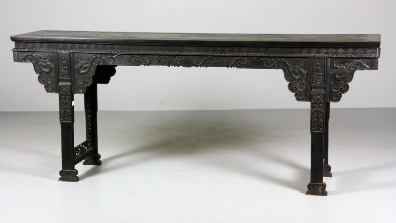 Chinese 19th C. Large Zitan Altar Table: Large zitan altar table, China, 19th century, decorated with a carved dragon pattern, 35" x 84 1/2" x 18 1/2".