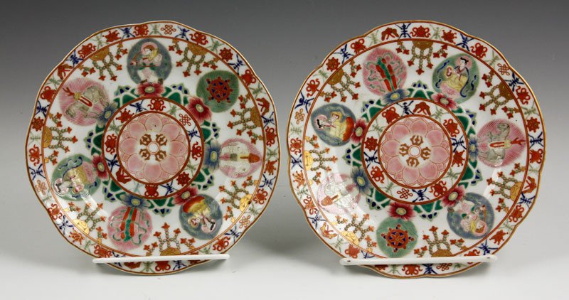 Chinese 18th/19th C. Pair of Famille Rose Plates: Pair of famille rose plates, China, 18th/19th century, the center having a central lotus flower motif surrounded by the eight Buddhist emblems, with a Mongolian mark, 6 5/8" h.
