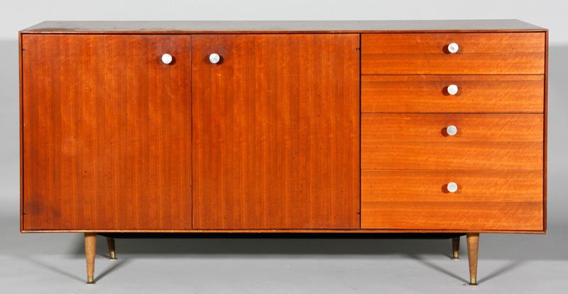 George Nelson Thin Edge Buffet: George Nelson thin edge buffet for Herman Miller, walnut, labeled inside drawer, two enclosed shelves, one cork-lined drawer, circa 1950s, 34" x 57 1/2" x 18 1/2". Provenance: From the collection of l