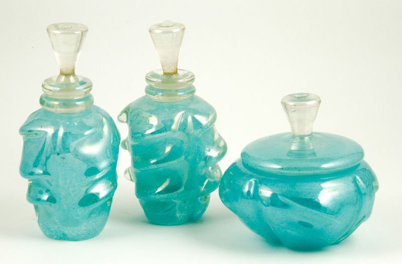 3 Pc. Murano Vanity Set: Three piece Murano Bollicine glass dresser/vanity accessories set, to include: two perfumes and a powder box, 6 3/4"h (tallest). Provenance: Collection of Robert Loy.