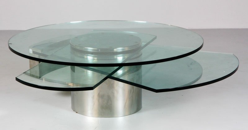 Jackson, “Self Winding Coffee Table": Dakota Jackson (American), “Self Winding Coffee Table” c. 1987, glass and chrome, with polaroid of table in original owner's home magazine and showcasing the table and an original newspaper interv