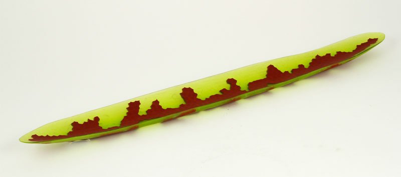 Santillana, "Coral Line Platten", Glass: Laura de Santillana (American b.1955), "Coral Line Platten", blown glass with red geometric design through center, 1995, 20 1/4" x 2 1/4". Provenance: Woodland Hills, California collector.