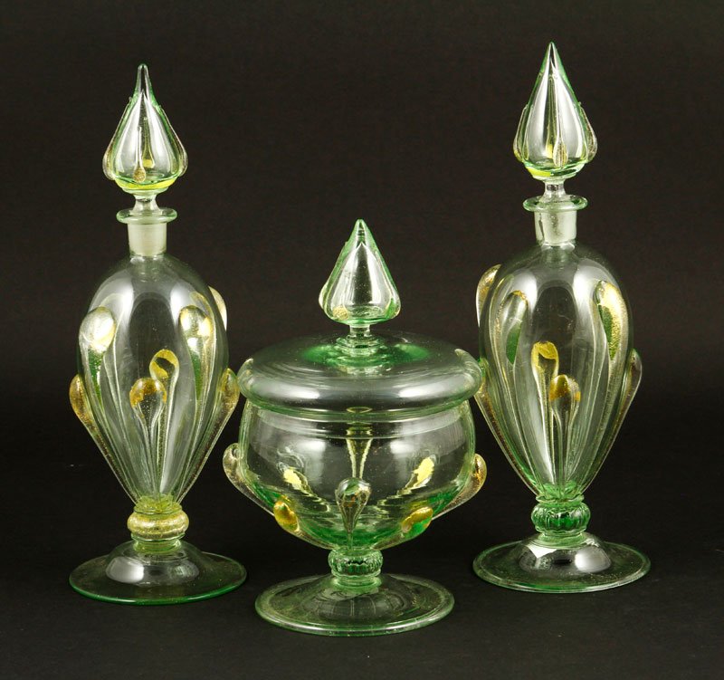 Traditional Muranese Vanity Set: Traditional Muranese vanity set, circa 1890, with traces of applicazion de foglia d'oro decoration, powder box, 5 3/4" h x 3 1/4", perfume bottles 8" h x 3" dia. Provenance: Collection of Robert Loy.