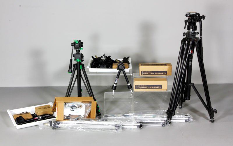 Collection of Photography Lighting Supports: Collection of photography lighting supports, to include: four Bogen Manfrotto tripods, various clamps, etc. by Manfrotto , also included in lot are two camera tripods, one Bogen Manfrotto model #3246 
