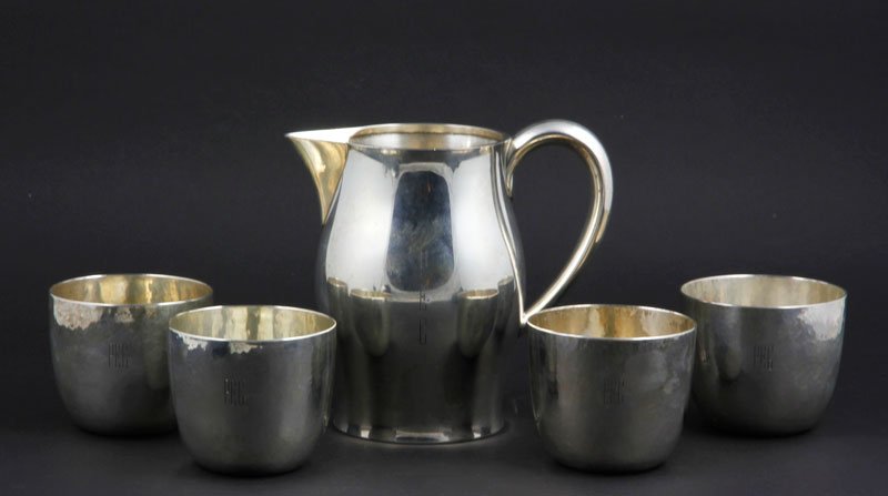 Sterling Hollowware Lot: Lot of sterling hollowware, to include: Tuttle, Paul Revere reproduction pitcher, 6"h; four ONC/ Shreve, Crump, & Low hammered tumblers, 2 3/4"h x 3 1/8"dia; approximately 32.9 troy oz TW. Provenance: