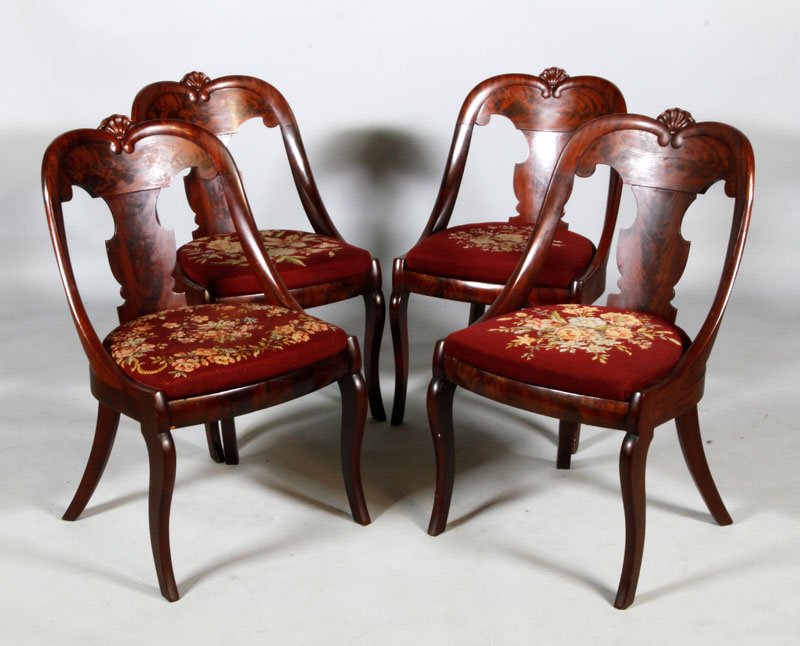 4 Empire Side Chairs: Four empire side chairs, crotch mahogany, shell motif, maritime form, needlepoint seats, 32"h (back), 17"h (seat).