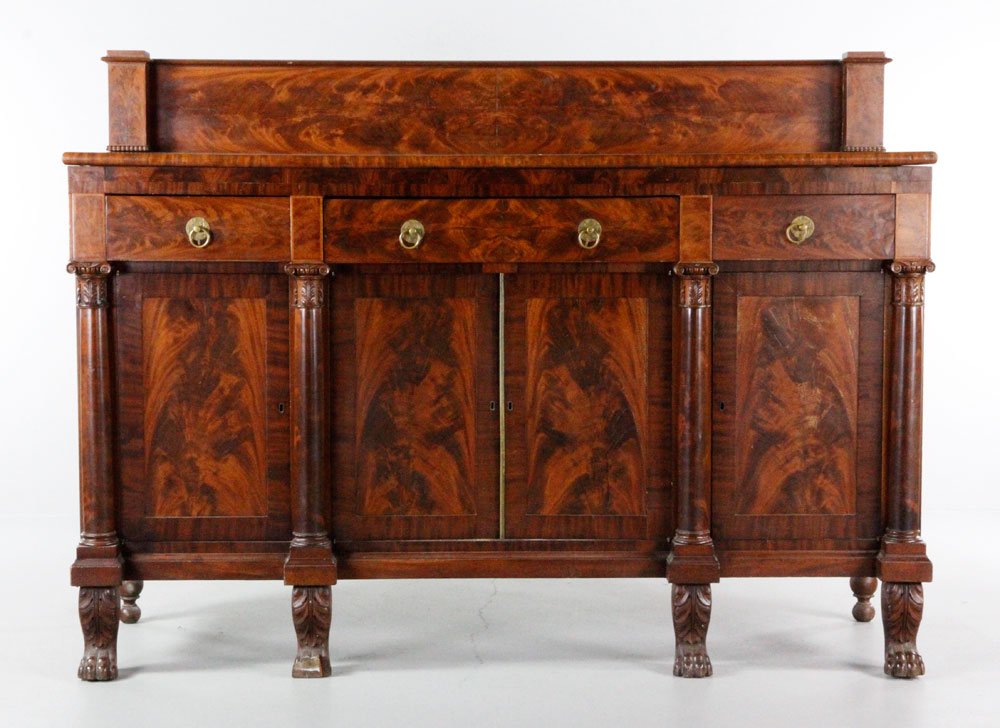 19th C. Figured Mahogany Sideboard: 19th century figured mahogany sideboard, four drawers over four doors, slide out writing surface on right side, and hairy paw feet, 53 1/2" h (overall) x 72 1/2" w x 27" d.