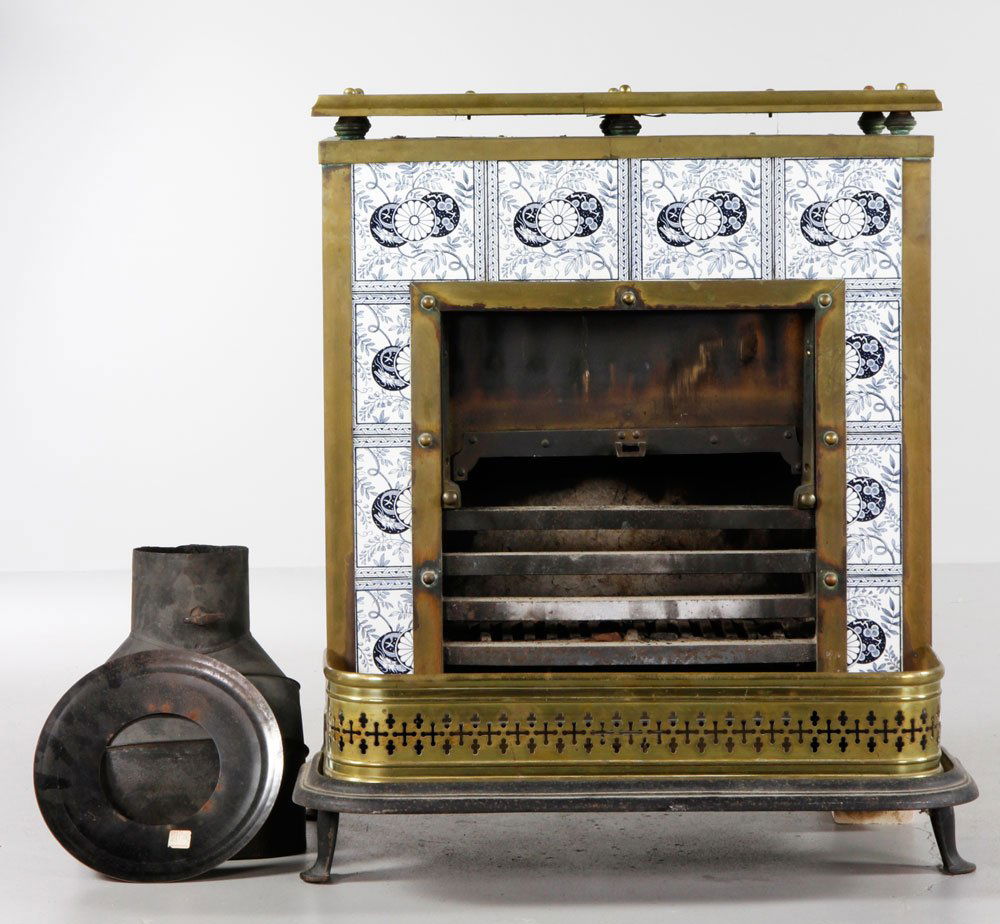Parlor Stove: Parlor stove with tile façade, brass trim and fender. Provenance: Estate of Alexander Brook.
