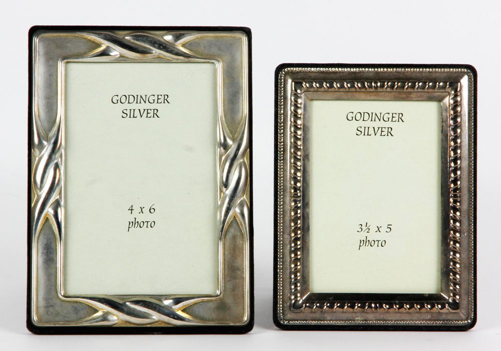 Lot of Two Godinger Sterling Frames: Lot of two sterling frames, Godinger silver, larger 7 1/2" x 5 1/4", 4" x 6" photo, smaller 6 1/3" x 4 3/4", 3 1/2" x 5" photo. Provenance: Property of Marla Maples.
