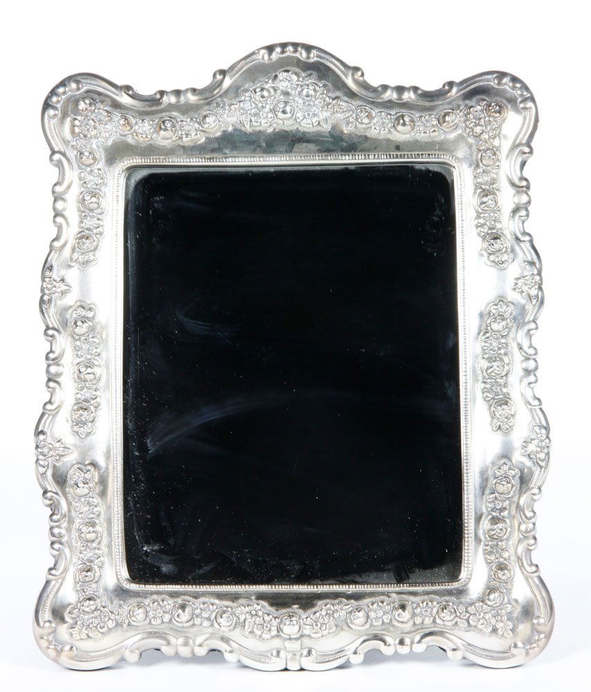 Sterling Framed Mirror: Mirror with sterling silver frame, marked 925 on top side, velvet backing, 12 1/4" x 11 5/8" x 7 1/2". Provenance: Property of Marla Maples.
