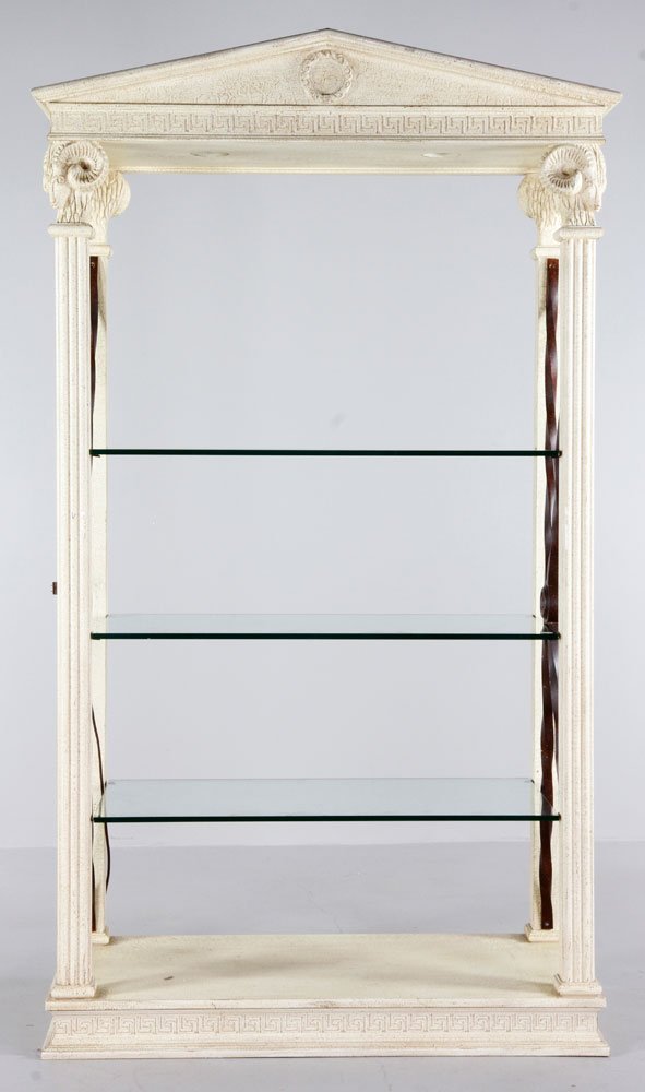 Versace Inspired Bookshelf: Versace inspired bookshelf, wood and glass with three shelves and carved ram heads at each corner, having two lights inside case at top, 81"h x 48"w x 23 1/2"d. Provenance: Property of Marla Maples.