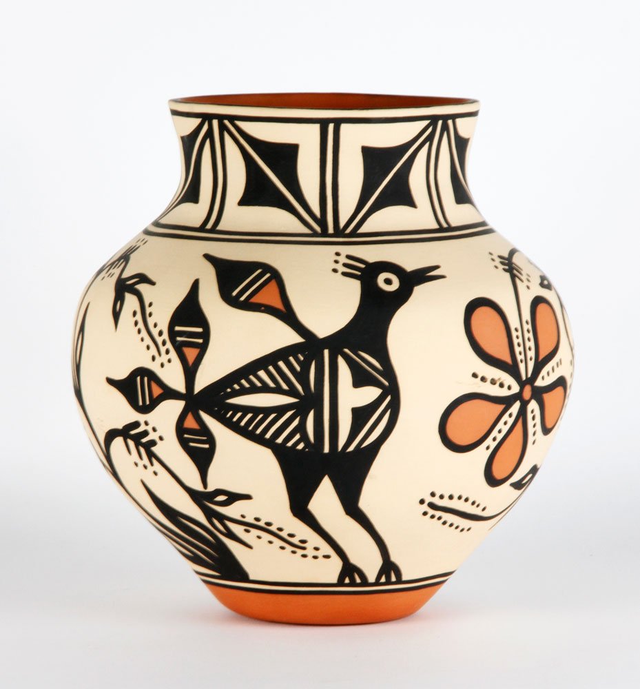 Santé Domingo Pueblo Pottery Vessel: Santé Domingo Pueblo New Mexico pottery vessel, signed T. Teworio, with geometric, design at neck with pattern of birds and branches throughout, 10'h x 9 1/2"dia. Provenance: Property of Marla Maples