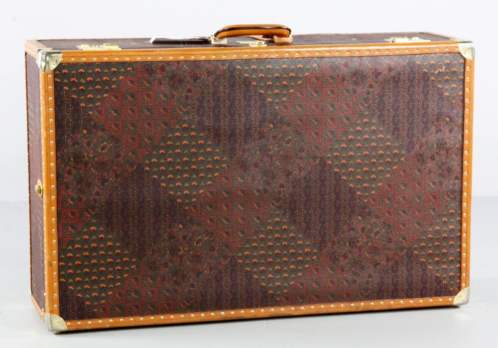 Original Escada Trunk: Original Escada trunk with brass locks and studs, locks stamped "Escada", with travel tag from Radisson Seven Seas marked Maples/Trump with original Trump Towers address listed, 10" x 33 1/4" x 21". P