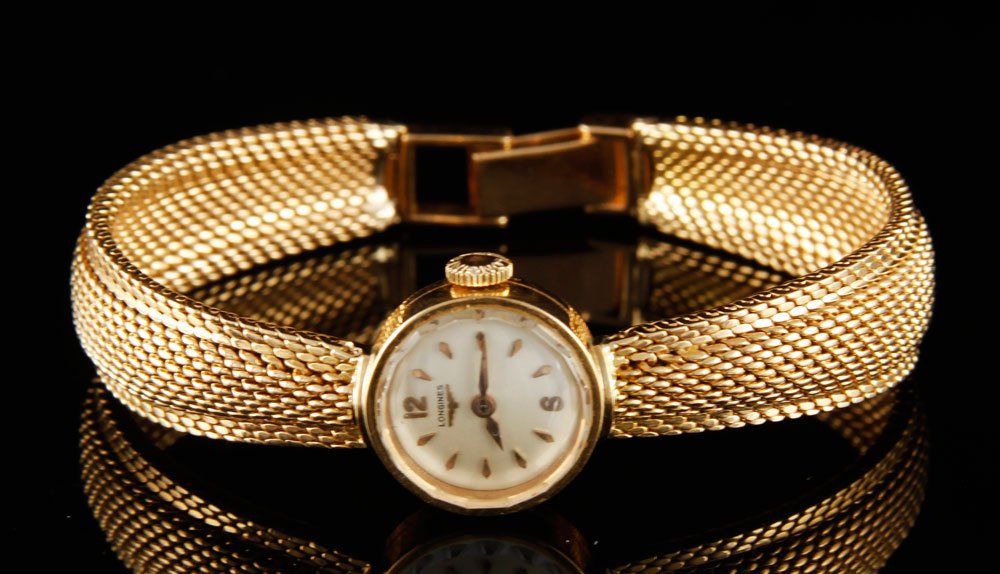 18K Yellow Gold Longines Ladies Watch: 18K yellow gold Longines ladies watch, 1/2" dia face, 6" l, approximately 1.0 oz/ 20 DWT TW (including movement). Operational condition not guaranteed.
