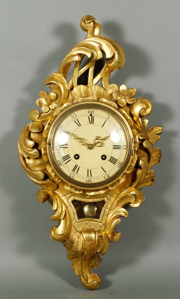 Westerstrand Wall Clock: Westerstrand wall clock, with carved gilt wood rococo case, 22 1/2" h x 12" w x 6" dia face. Provenance: From a Hamilton, MA estate.