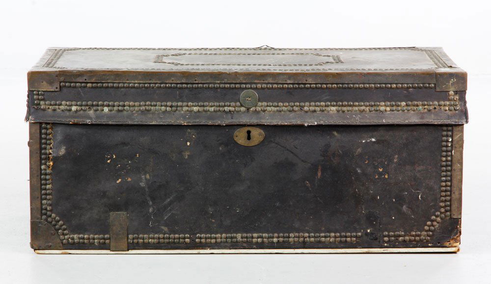 Leather Covered Camphor Trunk: Leather-covered, brass-studded, decorative camphor trunk, 13 1/4'' h x 30'' w x 15 1/2'' d. Provenance: The Estate of Alexander Brooks.