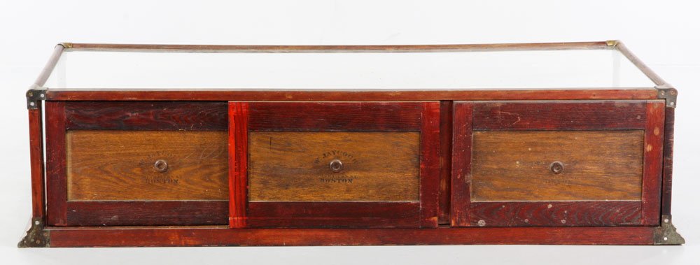 19th C. Glass Maple Display Cabinet: 19th Century Brass-trim, glass display cabinet, maple, 14 1/4'' h x 59'' w x 28'' d. Provenance: Estate of Alexander Brook.