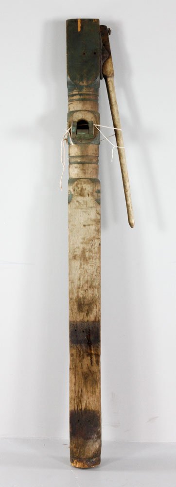 Large American Pumphead: Large American pump head, ruminants of red and blue paint, pine with cast iron fittings, turned stem, 77" h x 12 1/2" w x 5 1/2" d. Provenance: Estate of Alexander Brook.