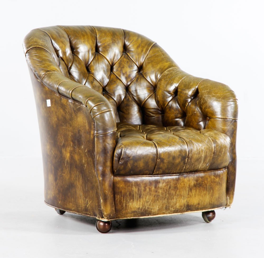 Bennett for Brickell Leather Club Chair: Ward Bennett for Brickell, leather tufted club chair of diminutive size, on original caster wheels, remnants of original paper label underside, leather showing appropriate age, 29 1/2" x 28 1/2" x 32"