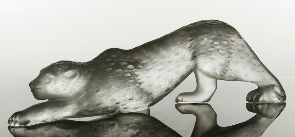 Lalique Zeila Panther Figure: Lalique Zeila panther figure in crouching stance, signed "Lalique France" underside of one foot, 4 1/2" x 14 1/2" x 4 1/2".