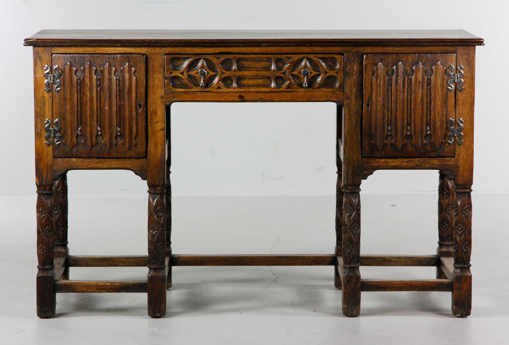 Arts & Crafts Mission Style Sideboard: Arts and Crafts Mission style sideboard, oak, with one center drawer and two doors, one at left and one at right end of sideboard, over raised/turned feet, 33 1/2" x 53 1/2" x 21 1/2". Provenance: Pro