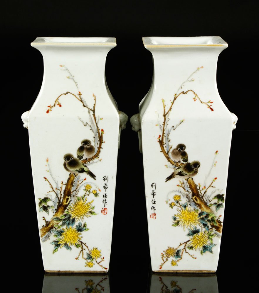 Chinese 20th C. Famille Rose Square Vases: Pair of famille rose square vases, China, early 20th century, having mask and ring handles at the sides, depicting a pair of songbirds on a branch above chrysanthemums, a single songbird on the revers