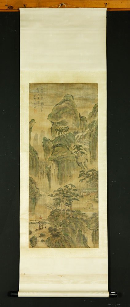 Chinese Scroll Painting: Scroll painting, China, of a mountain landscape scene with a figure on a bridge, watercolor on paper, 37" l x 15 1/2" w. Provenance: From the family of Lawrence Mead, co-director of the International 