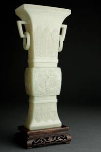 Chinese Jade Fang Gu Vase. Qing (1644-1911): Carved with a fluted and squared rim, decorated with archaic designs. The vase is rendered from a fine material having consistent color and a fine polish overall even continuing to interior where the