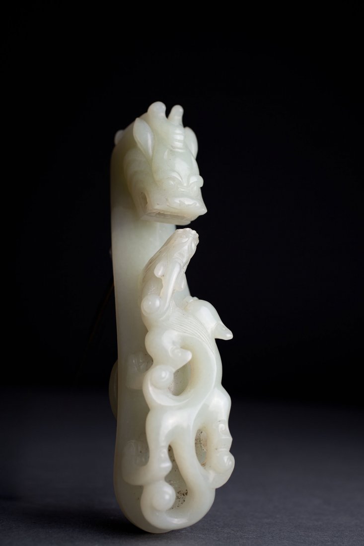 Antique Chinese Large Celadon Jade Belt Hook Qing: Chinese Celadon Jade Belt Hook, Qing (1644-1913). The hook carved as confronting dragons carved in high relief, 5 1/4" l. Provenance: -Private Collection
