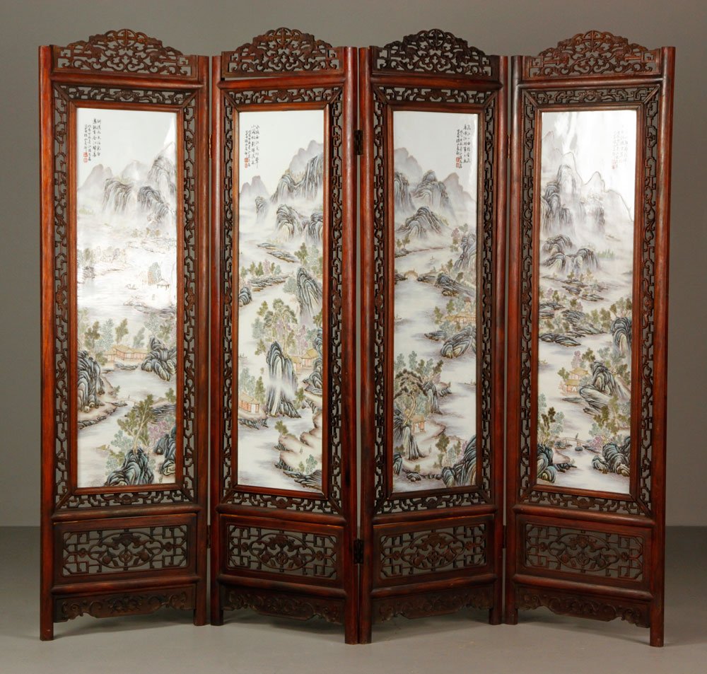 Chinese Hardwood and Porcelain Screen: Four paneled carved hardwood screen, China, mounted with large porcelain plaques, overall 67” x 81”.