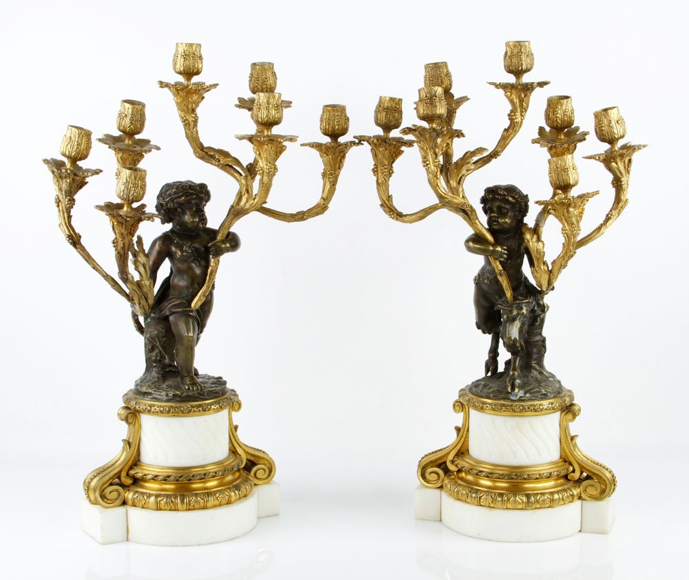 Pr. 19th C. French Candelabra: Pair of 19th century French candelabra with seven candles, ormolu and white marble base, 22" x 14". Provenance: Los Angeles, CA collector.